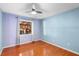 Bedroom with a large window letting in lots of natural light and a ceiling fan at 1475 Kettledrum Trl, Deltona, FL 32725
