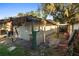 Exterior shot of the exterior enclosure made of metal sheeting and fence at 1475 Kettledrum Trl, Deltona, FL 32725