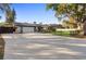 Charming exterior of a single-story home with an attached garage and a well-maintained front yard at 1475 Kettledrum Trl, Deltona, FL 32725