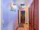 Hallway with neutral walls, tiled flooring, and closet space at 1475 Kettledrum Trl, Deltona, FL 32725