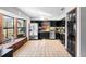 Well-lit kitchen featuring stainless steel appliances, dark cabinetry, and a window bench at 1475 Kettledrum Trl, Deltona, FL 32725