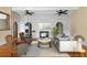 Bright and airy living room with a fireplace, comfortable seating, and stylish decor at 1475 Kettledrum Trl, Deltona, FL 32725