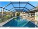 Inviting screened-in pool and spa offer the perfect backyard oasis for relaxation and entertainment at 1475 Kettledrum Trl, Deltona, FL 32725