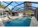 Inviting screened-in pool area with hot tub and outdoor seating, perfect for relaxation and entertainment at 1475 Kettledrum Trl, Deltona, FL 32725
