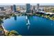 Aerial view of a lake with a fountain, surrounded by a city skyline and lush greenery at 150 E Robinson St # 1007, Orlando, FL 32801