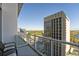 Condo balcony view featuring a large office building and glimpses of a nearby lake at 150 E Robinson St # 1007, Orlando, FL 32801