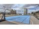 Rooftop basketball court surrounded by cityscape, a private amenity for residents at 150 E Robinson St # 1007, Orlando, FL 32801