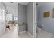 Contemporary condo featuring modern half bath with unique artwork and sleek fixtures at 150 E Robinson St # 1007, Orlando, FL 32801