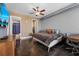 Modern bedroom with exposed ductwork, ceiling fan, and ensuite bathroom and closet at 150 E Robinson St # 1007, Orlando, FL 32801