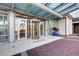 Elegant building entrance featuring a revolving door under a glass awning at 150 E Robinson St # 1007, Orlando, FL 32801