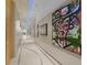 Hallway featuring modern art and design with track lighting and a sleek design at 150 E Robinson St # 1007, Orlando, FL 32801