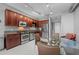 Contemporary kitchen with stainless steel appliances, granite counters, and a glass dining table at 150 E Robinson St # 1007, Orlando, FL 32801