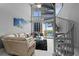 Bright living room with spiral staircase, modern decor, and stunning water views at 150 E Robinson St # 1007, Orlando, FL 32801