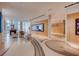 Open lobby area with comfortable seating, artwork, and terrazzo flooring at 150 E Robinson St # 1007, Orlando, FL 32801