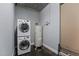 A utility room features a stacked washer and dryer, and hot water tank at 150 E Robinson St # 1007, Orlando, FL 32801