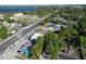 An aerial view of a neighborhood, with a lake, trees, and houses at 1505 25Th St, Orlando, FL 32805