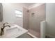 The bathroom includes a tiled walk-in shower, dual sinks, and a small window at 1505 25Th St, Orlando, FL 32805