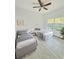 A cozy bedroom with two twin beds, a ceiling fan, and a large window at 1505 25Th St, Orlando, FL 32805