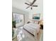 A light and bright bedroom featuring a ceiling fan, natural light, and neutral décor at 1505 25Th St, Orlando, FL 32805