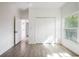 Well-lit bedroom featuring a window, closet, and neutral-toned walls at 1505 25Th St, Orlando, FL 32805