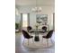 Stylish dining room with modern chandelier, round table, and unique velvet upholstered chairs at 1505 25Th St, Orlando, FL 32805