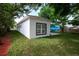 Exterior of the home showing the backyard, neutral color palette, and landscaping at 1505 25Th St, Orlando, FL 32805