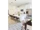An open-concept kitchen with a large island, stainless appliances, and pendant lighting above the quartz countertops at 1505 25Th St, Orlando, FL 32805