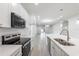 Bright kitchen with a peninsula counter, stainless appliances, and contemporary lighting at 1505 25Th St, Orlando, FL 32805