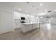 Spacious kitchen featuring stainless steel appliances, quartz countertops, and an expansive island at 1505 25Th St, Orlando, FL 32805