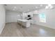 Modern kitchen with a large island, stainless appliances, and an open layout that flows into the living space at 1505 25Th St, Orlando, FL 32805
