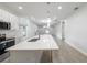 Modern kitchen featuring an island with a white countertop, stainless steel appliances, and an open layout at 1505 25Th St, Orlando, FL 32805