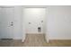 A bright laundry room is shown with neutral colored flooring and washer and dryer hookups at 1505 25Th St, Orlando, FL 32805