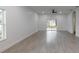 Living room featuring sliding glass doors leading to the backyard and neutral walls at 1505 25Th St, Orlando, FL 32805
