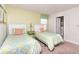 Comfortable bedroom featuring twin beds, bright accents, and a tranquil atmosphere at 1551 Observer Ln, Davenport, FL 33896