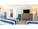 Nautical themed bedroom with three beds, charming maritime decor, and ample natural light at 1551 Observer Ln, Davenport, FL 33896