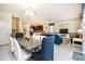 Spacious open floor plan showcases a dining area, living room, and kitchen with modern appliances at 1551 Observer Ln, Davenport, FL 33896