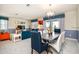Open floor plan combining the dining and living areas allows for seamless entertaining and relaxation at 1551 Observer Ln, Davenport, FL 33896