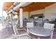 Outdoor bar and lounge area with modern seating and a stylish bar counter at 1551 Observer Ln, Davenport, FL 33896