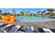 Resort style pool area with a lazy river, beach chairs and palm trees at 1551 Observer Ln, Davenport, FL 33896