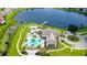Stunning aerial view of community center with pool, playground, and lake access with dock at 15633 Panther Lake Dr, Winter Garden, FL 34787