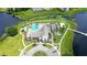 An aerial view of the clubhouse with pool, playground, and surrounding landscape, showcasing the community's recreational amenities at 15633 Panther Lake Dr, Winter Garden, FL 34787