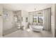 Modern bathroom with a soaking tub, walk-in shower, and stylish fixtures at 15633 Panther Lake Dr, Winter Garden, FL 34787