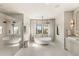 Bright bathroom featuring a modern soaking tub, walk-in shower, and dual vanities at 15633 Panther Lake Dr, Winter Garden, FL 34787
