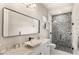Modern bathroom featuring marble countertops, vessel sink, and a unique mosaic tile shower at 15633 Panther Lake Dr, Winter Garden, FL 34787