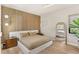 Contemporary bedroom featuring accent wall, ceiling fan, and neutral decor at 15633 Panther Lake Dr, Winter Garden, FL 34787