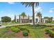 Stunning clubhouse view surrounded by lush landscaping, showcasing the entrance and manicured grounds at 15633 Panther Lake Dr, Winter Garden, FL 34787
