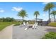 Outdoor gathering area with a fire pit surrounded by chairs, perfect for relaxing and socializing at 15633 Panther Lake Dr, Winter Garden, FL 34787