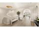 Elegant foyer with modern chandelier, arched doorway, light wood floors, and stylish decor at 15633 Panther Lake Dr, Winter Garden, FL 34787