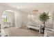 Bright hallway with a statement chandelier and stylish seating, perfect for a modern home at 15633 Panther Lake Dr, Winter Garden, FL 34787