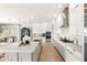 Spacious kitchen featuring a large island, stainless steel appliances, and stylish white cabinetry at 15633 Panther Lake Dr, Winter Garden, FL 34787